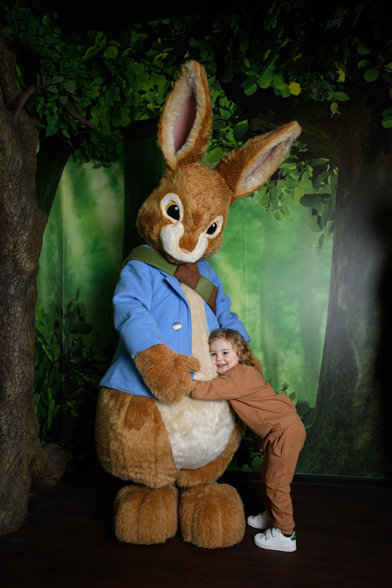 Child hugging Peter Rabbit at Peter Rabbit: Explore and Play attraction Blackpool