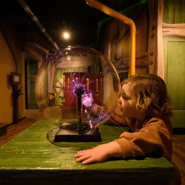 Toddler at the Invention Workshop at Peter Rabbit Explore and Play attraction, Blackpool