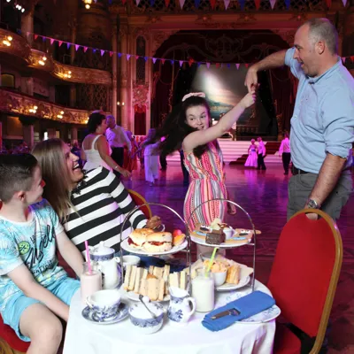 Family enjoying afternoon tea at the Blackpool Tower Ballroom