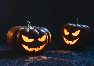 Two Halloween Pumpkins lit up
