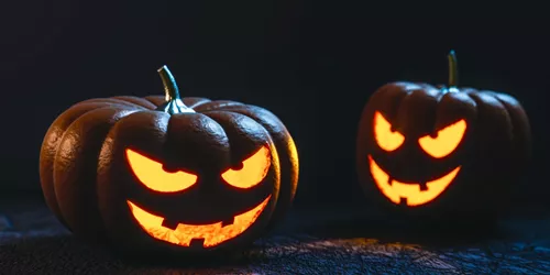 Two Halloween Pumpkins lit up