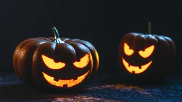 Two Halloween Pumpkins lit up