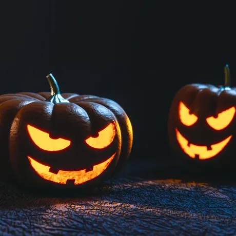 Two Halloween Pumpkins lit up